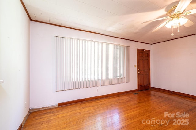 3954 E Burke Blvd, Connelly Springs, NC 28612 - spare room with crown molding, wood-type flooring, and a ceiling fan