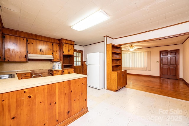 3954 E Burke Blvd, Connelly Springs, NC 28612 - kitchen with freestanding refrigerator, open shelves, and brown cabinets