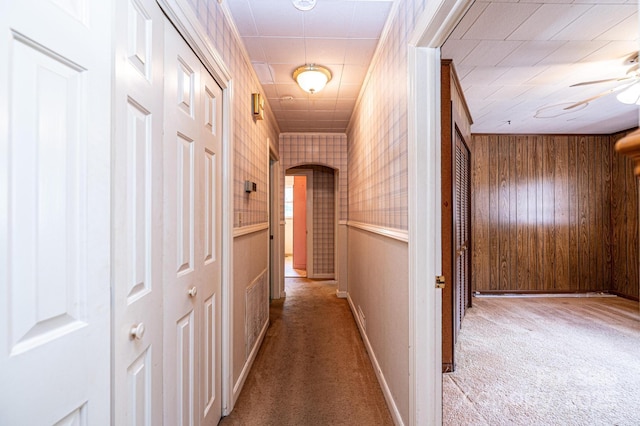 3954 E Burke Blvd, Connelly Springs, NC 28612 - hallway with carpet floors, arched walkways, wood walls, and crown molding