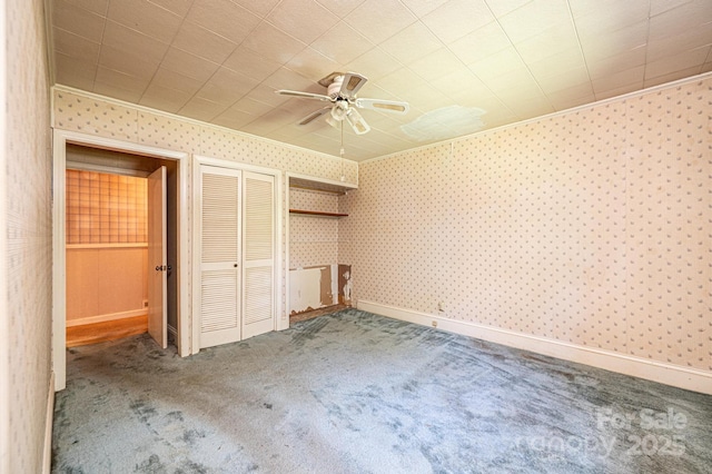 3954 E Burke Blvd, Connelly Springs, NC 28612 - unfurnished bedroom with carpet floors, wallpapered walls, ornamental molding, ceiling fan, and a closet