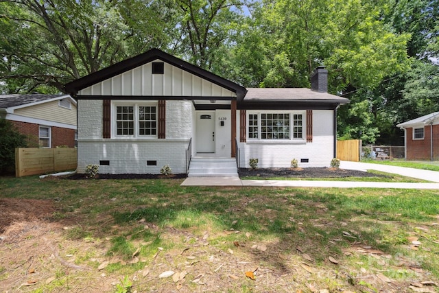 5420 Gwynne Ave, Charlotte, NC 28205 - view of front of home with brick siding, crawl space, a chimney, and board and batten siding
