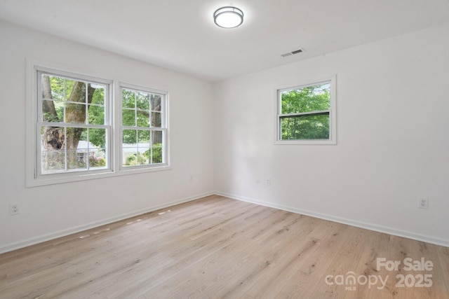 5420 Gwynne Ave, Charlotte, NC 28205 - unfurnished room with plenty of natural light and light wood-style floors