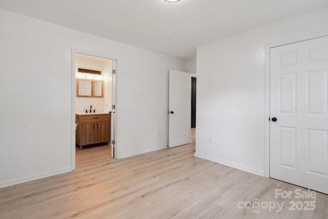 5420 Gwynne Ave, Charlotte, NC 28205 - unfurnished bedroom featuring light wood finished floors and connected bathroom