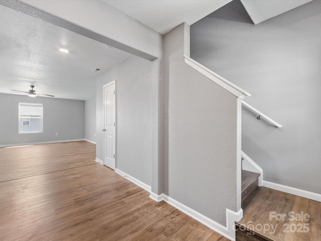 9136 Creedmore Hills Dr, Charlotte, NC 28214 - stairs with wood finished floors and ceiling fan