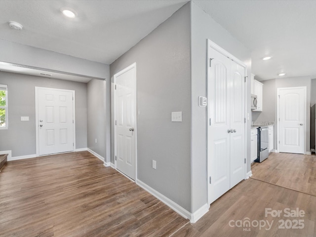 9136 Creedmore Hills Dr, Charlotte, NC 28214 - foyer entrance with light wood finished floors and recessed lighting