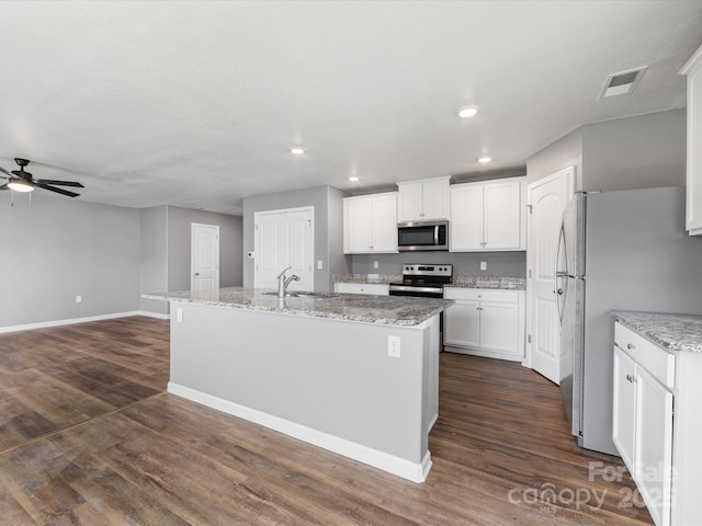 9136 Creedmore Hills Dr, Charlotte, NC 28214 - kitchen featuring stainless steel appliances, ceiling fan, white cabinetry, recessed lighting, and dark wood-style floors