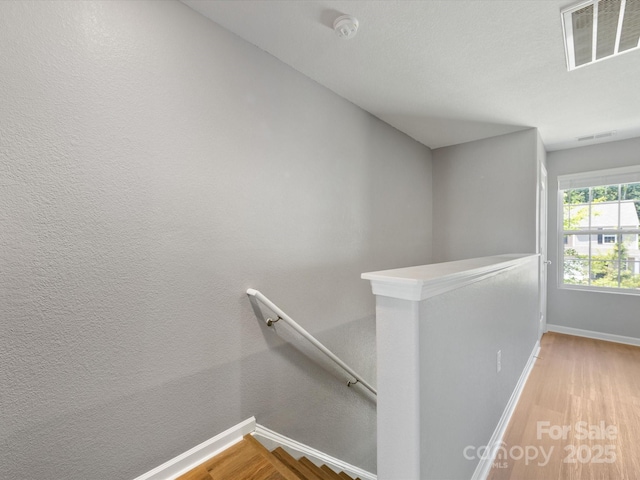 9136 Creedmore Hills Dr, Charlotte, NC 28214 - stairway featuring baseboards and wood finished floors