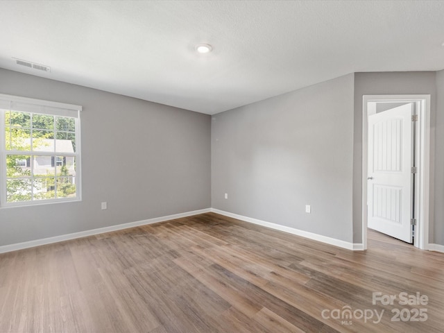 9136 Creedmore Hills Dr, Charlotte, NC 28214 - spare room featuring baseboards and wood finished floors