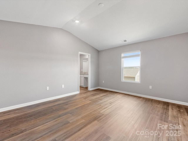 9136 Creedmore Hills Dr, Charlotte, NC 28214 - unfurnished bedroom featuring lofted ceiling and wood finished floors