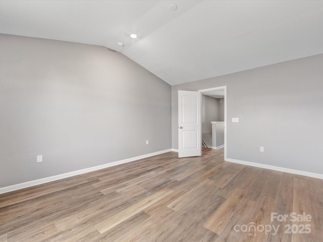 9136 Creedmore Hills Dr, Charlotte, NC 28214 - empty room with lofted ceiling, light wood-style floors, and recessed lighting