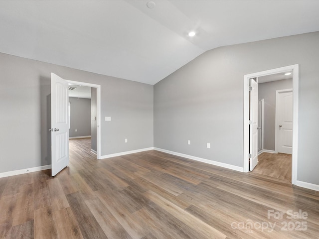 9136 Creedmore Hills Dr, Charlotte, NC 28214 - spare room with lofted ceiling, wood finished floors, and ceiling fan