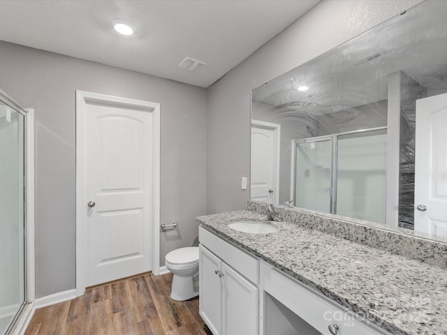 9136 Creedmore Hills Dr, Charlotte, NC 28214 - bathroom featuring a stall shower, vanity, and wood finished floors