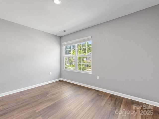 9136 Creedmore Hills Dr, Charlotte, NC 28214 - spare room featuring wood finished floors and baseboards