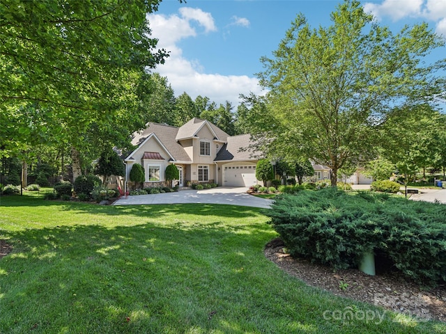 145 Fernbrook Way, Hendersonville, NC 28791 - view of front facade with a garage, a front lawn, driveway, and stucco siding