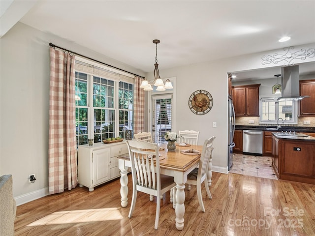 145 Fernbrook Way, Hendersonville, NC 28791 - dining area featuring light wood finished floors and a chandelier