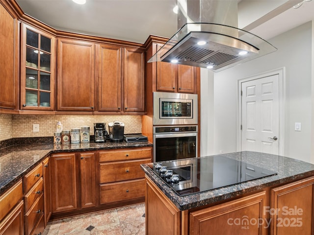 145 Fernbrook Way, Hendersonville, NC 28791 - kitchen with appliances with stainless steel finishes, island exhaust hood, decorative backsplash, and glass insert cabinets