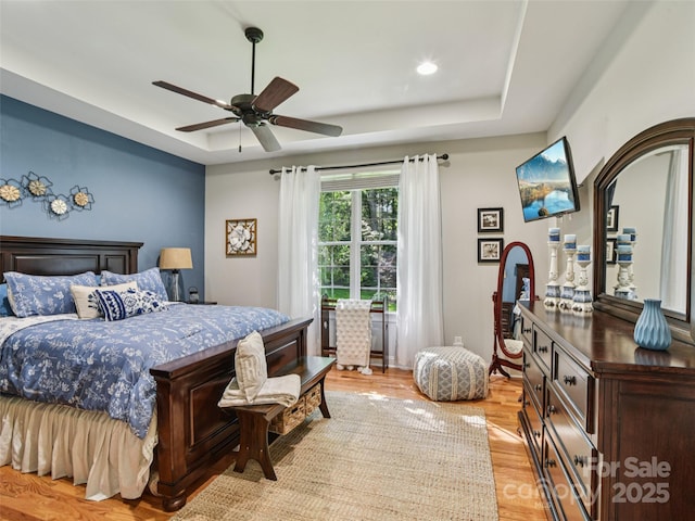 145 Fernbrook Way, Hendersonville, NC 28791 - bedroom with a tray ceiling, light wood-style floors, and ceiling fan
