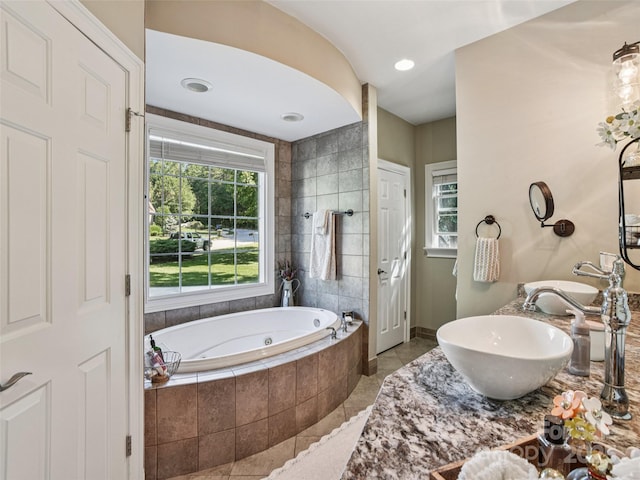 145 Fernbrook Way, Hendersonville, NC 28791 - full bath featuring tile patterned flooring, a tub with jets, plenty of natural light, and double vanity