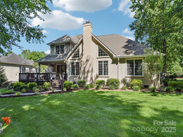 145 Fernbrook Way, Hendersonville, NC 28791 - back of house with stucco siding, a chimney, a wooden deck, and a shingled roof