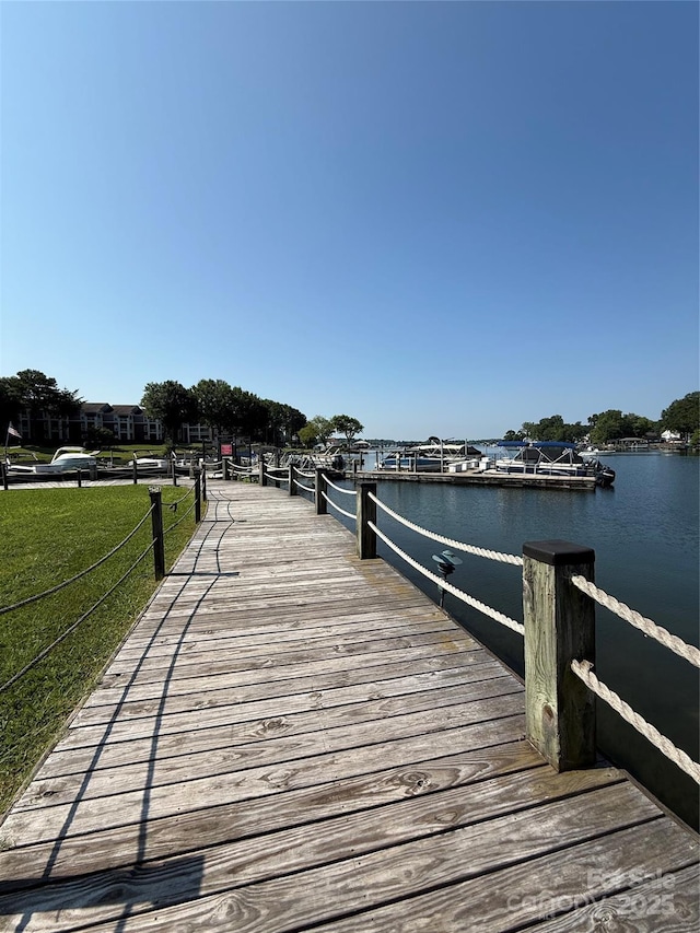 18511 Harborside Dr, Cornelius, NC 28031 - dock area with a water view and a lawn