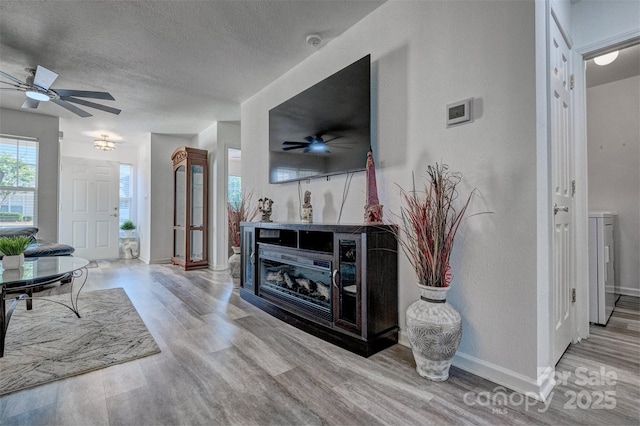 1504 Harpers Inlet Dr, Lake Wylie, SC 29710 - living area featuring wood finished floors, ceiling fan, a textured ceiling, and washer / clothes dryer