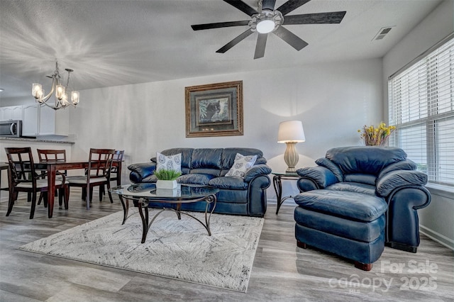 1504 Harpers Inlet Dr, Lake Wylie, SC 29710 - living room featuring plenty of natural light, a chandelier, and wood finished floors