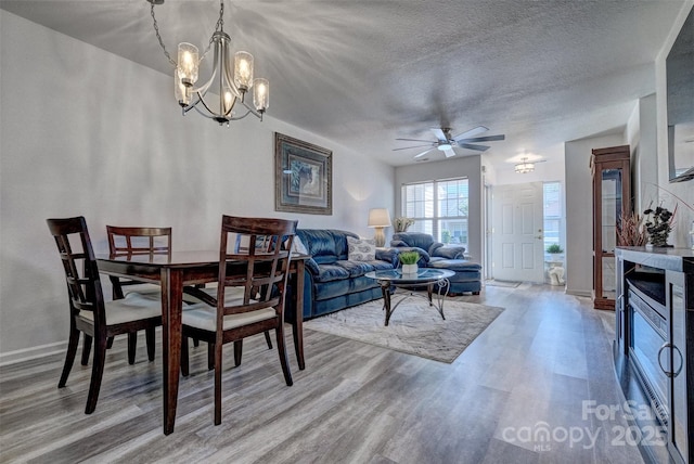 1504 Harpers Inlet Dr, Lake Wylie, SC 29710 - dining area with wood finished floors, ceiling fan, a chandelier, and a textured ceiling