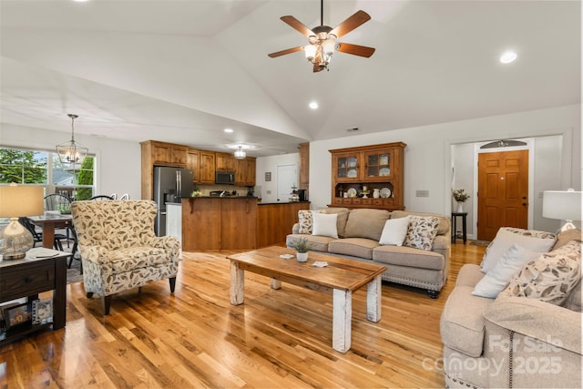 121 Maplewood Ct, Hudson, NC 28638 - living area with lofted ceiling, a ceiling fan, light wood finished floors, recessed lighting, and a chandelier