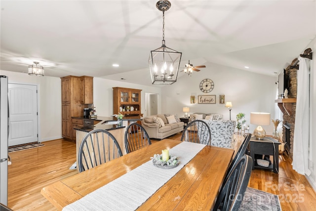 121 Maplewood Ct, Hudson, NC 28638 - dining area featuring a chandelier, light wood-style floors, vaulted ceiling, and recessed lighting