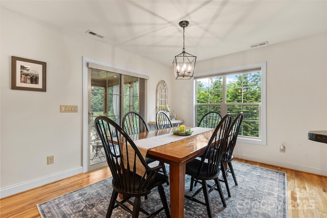 121 Maplewood Ct, Hudson, NC 28638 - dining area featuring a chandelier and light wood-style floors