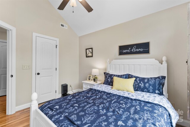 121 Maplewood Ct, Hudson, NC 28638 - bedroom featuring wood finished floors, high vaulted ceiling, and a ceiling fan
