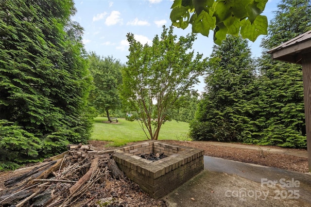 121 Maplewood Ct, Hudson, NC 28638 - view of green lawn featuring a fire pit
