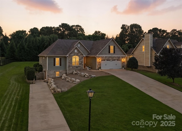 121 Maplewood Ct, Hudson, NC 28638 - view of front of home with driveway, stone siding, a lawn, and an attached garage