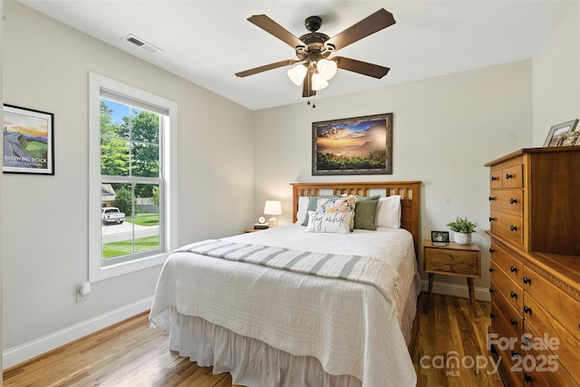 121 Maplewood Ct, Hudson, NC 28638 - bedroom featuring wood finished floors and a ceiling fan