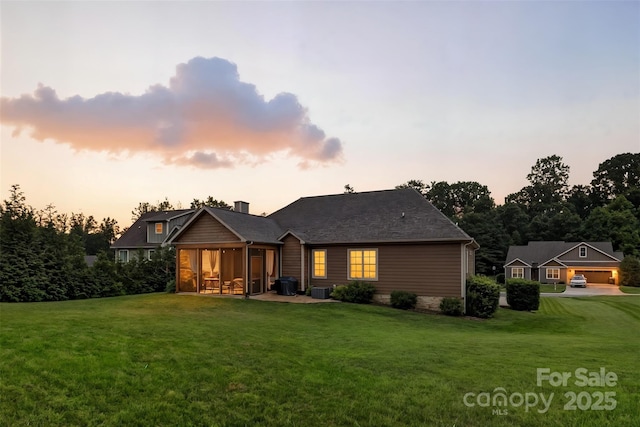 121 Maplewood Ct, Hudson, NC 28638 - rear view of house with a sunroom and a yard