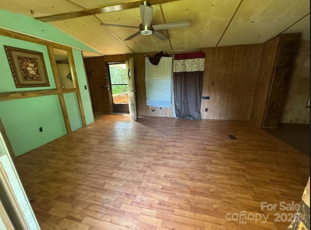 114 Victoria Ct, Cherryville, NC 28021 - unfurnished room featuring wooden walls, a ceiling fan, and wood finished floors