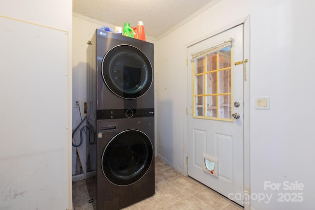 16 Rusty Clay Rdg, Fairview, NC 28730 - laundry room with stacked washer / drying machine, crown molding, and a textured ceiling