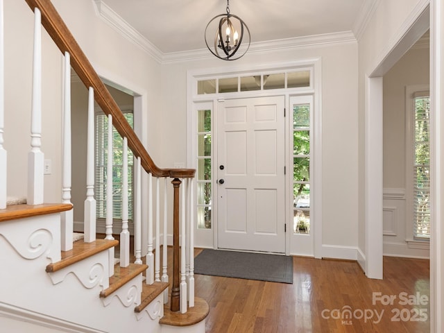 10333 Scott Gate Ct, Charlotte, NC 28277 - entryway with plenty of natural light, wood finished floors, crown molding, a chandelier, and stairs