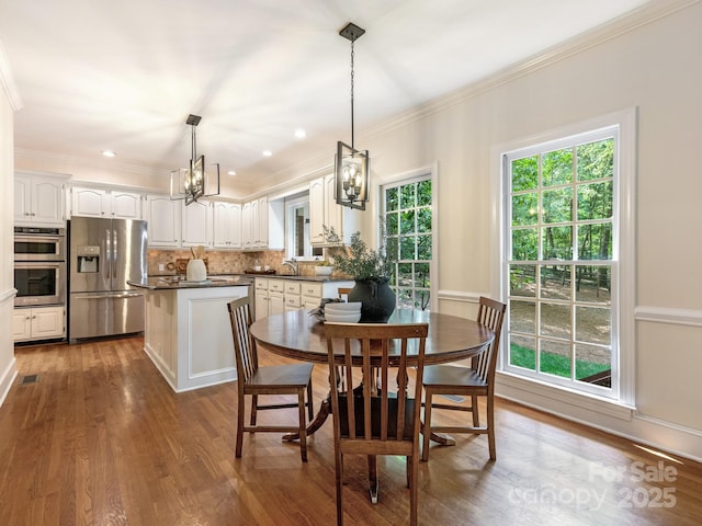 10333 Scott Gate Ct, Charlotte, NC 28277 - dining room featuring a chandelier, ornamental molding, dark wood-style floors, and recessed lighting