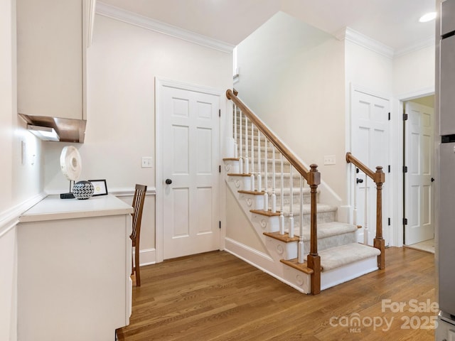 10333 Scott Gate Ct, Charlotte, NC 28277 - staircase featuring crown molding and wood finished floors