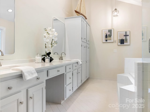 10333 Scott Gate Ct, Charlotte, NC 28277 - full bathroom with double vanity, tile patterned flooring, a bath, and recessed lighting