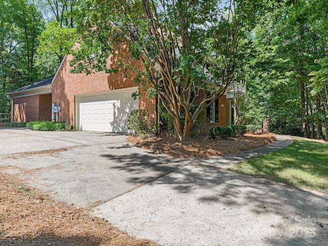 10333 Scott Gate Ct, Charlotte, NC 28277 - view of front of home featuring brick siding, driveway, and a garage