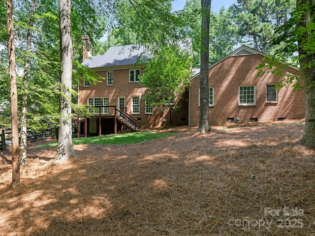 10333 Scott Gate Ct, Charlotte, NC 28277 - back of house featuring stairway, crawl space, a chimney, a deck, and brick siding