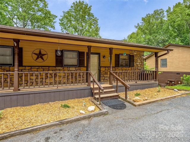 128 View De Lake Dr, Etowah, NC 28729 - ranch-style house with a porch and stone siding