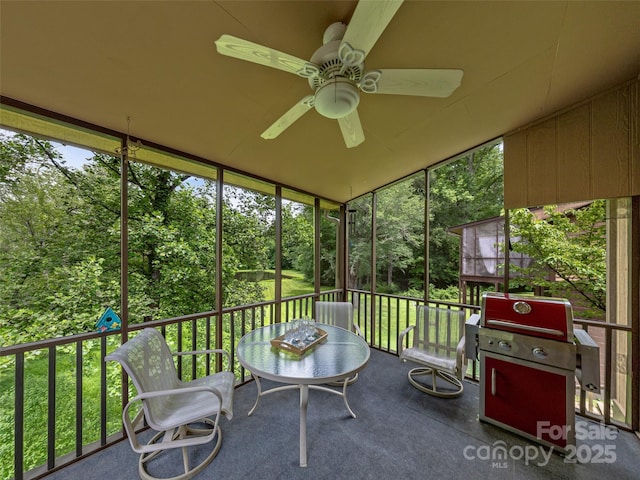 128 View De Lake Dr, Etowah, NC 28729 - sunroom featuring ceiling fan and view of wooded area