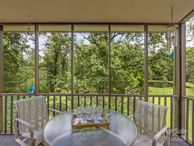 128 View De Lake Dr, Etowah, NC 28729 - sunroom / solarium featuring outdoor dining area and view of wooded area