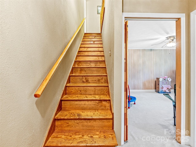 128 View De Lake Dr, Etowah, NC 28729 - staircase with carpet, a textured wall, wood walls, and a ceiling fan