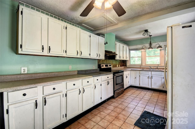 161 Pandora Cir, Canton, NC 28716 - kitchen featuring stainless steel range with electric stovetop, freestanding refrigerator, white cabinets, under cabinet range hood, and a ceiling fan