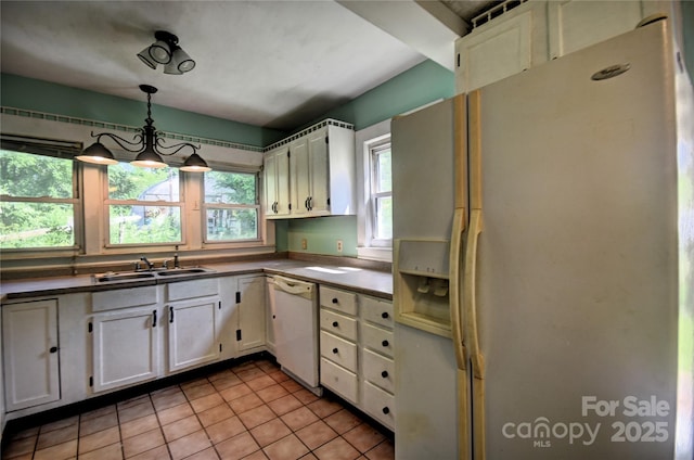 161 Pandora Cir, Canton, NC 28716 - kitchen featuring white appliances, white cabinetry, light tile patterned floors, dark countertops, and decorative light fixtures