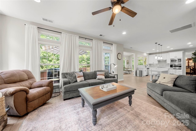 1125 Victoria Blake Ln, Belmont, NC 28012 - living room with light wood-type flooring, a ceiling fan, and recessed lighting